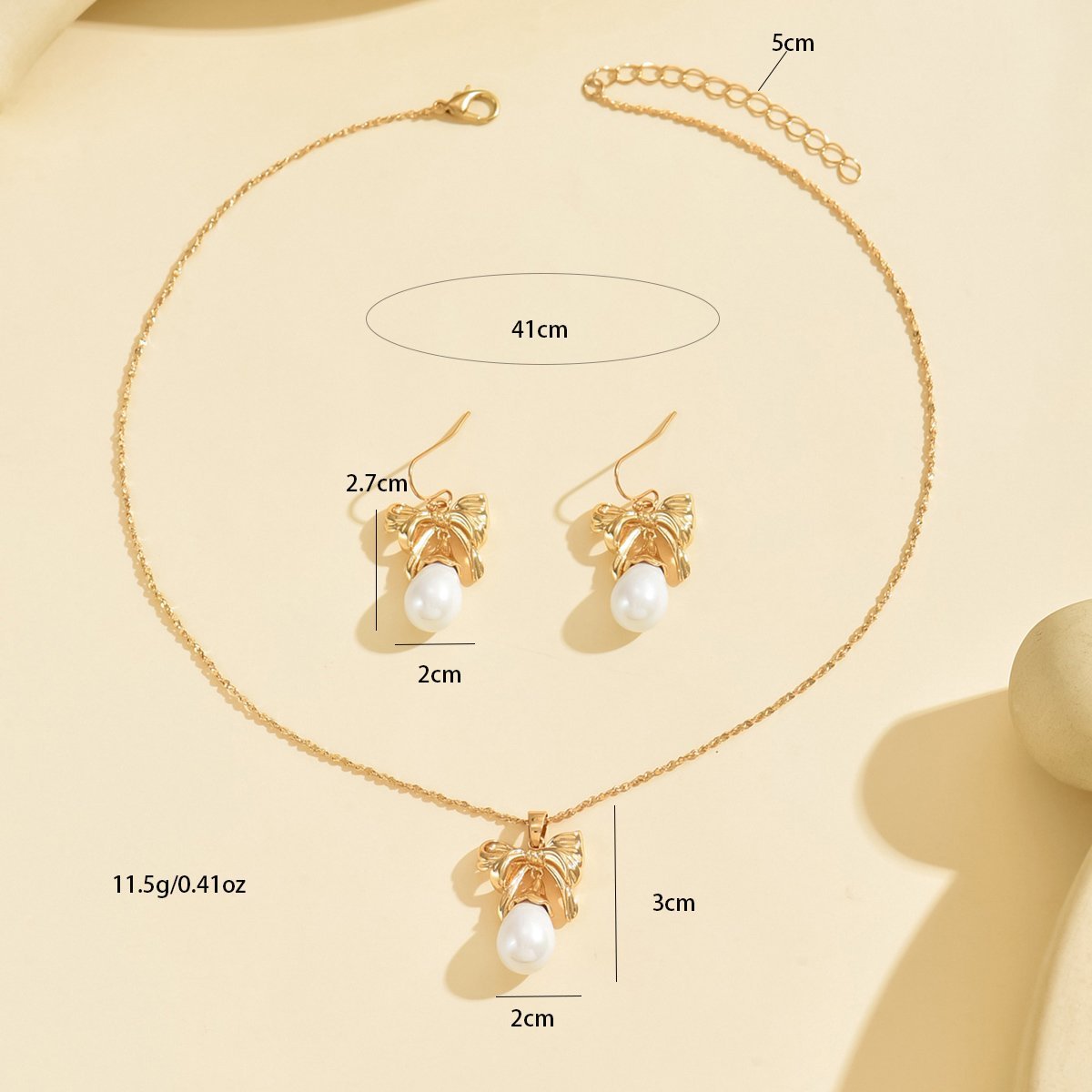 Elegant Gold-Toned Bow & Pearl Jewelry Set - Necklace & Earrings